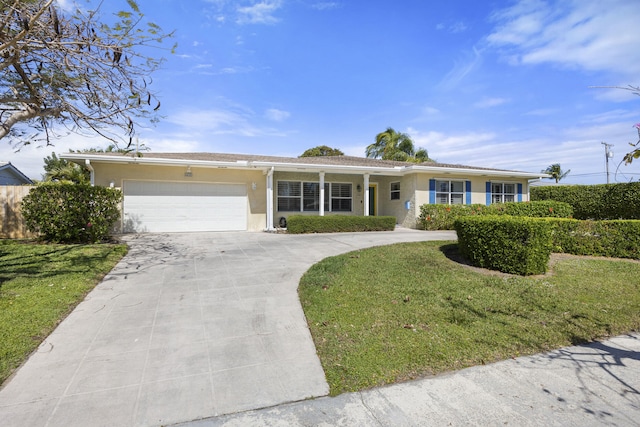 single story home with a garage and a front yard