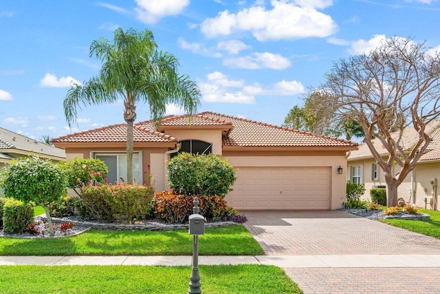 mediterranean / spanish house with a garage