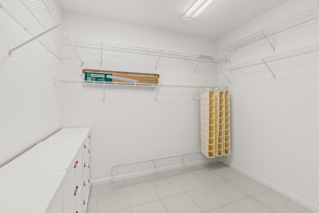 spacious closet featuring light tile patterned floors