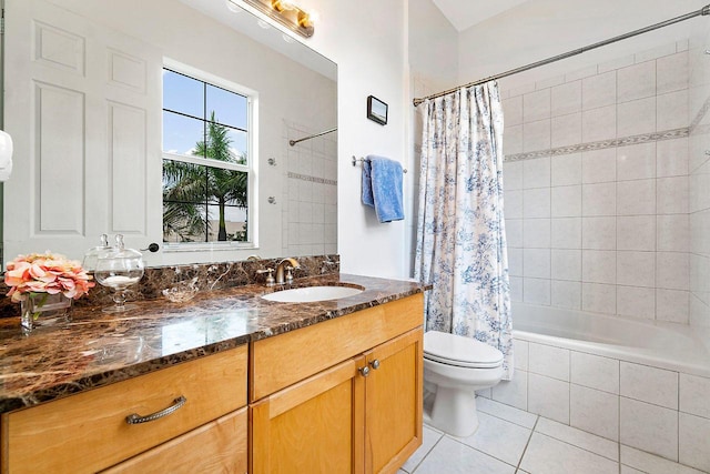 full bathroom with shower / tub combo, vanity, toilet, and tile patterned flooring