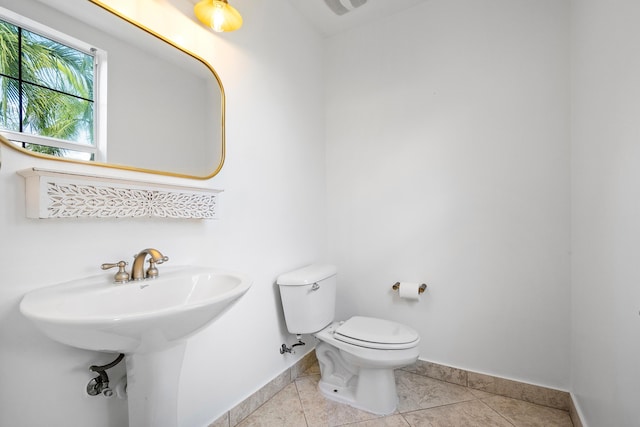 bathroom featuring tile patterned flooring and toilet