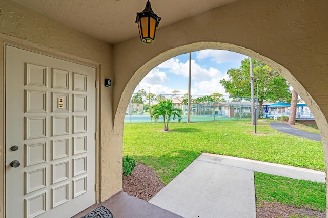 exterior space featuring a yard and stucco siding