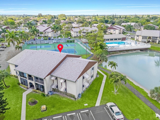 birds eye view of property with a residential view and a water view