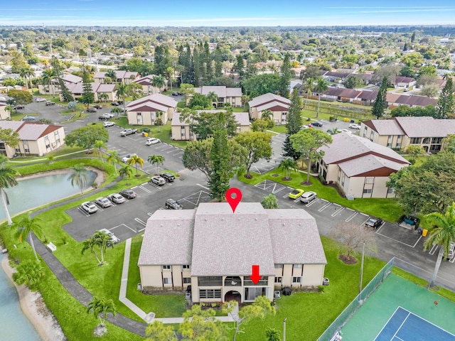 bird's eye view featuring a water view and a residential view