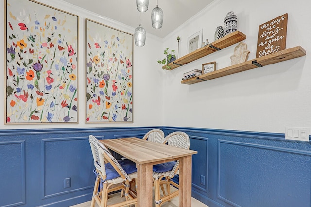 dining space with crown molding