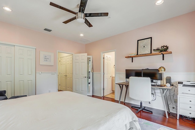 bedroom with hardwood / wood-style flooring and ceiling fan