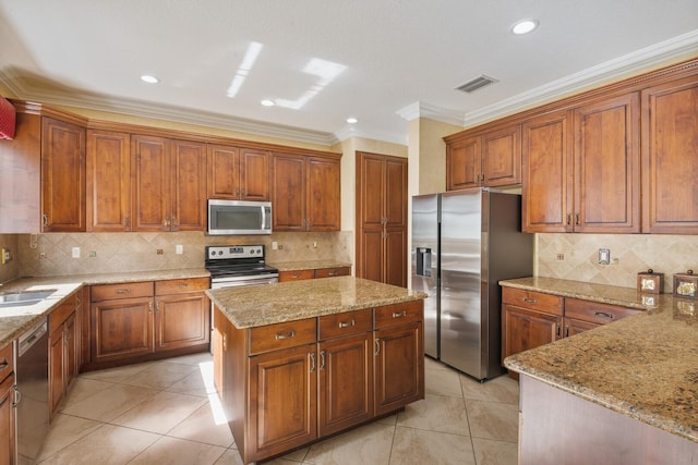 kitchen featuring a sink, light tile patterned floors, light stone countertops, and stainless steel appliances