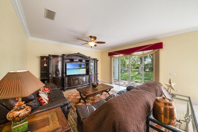 tiled living area featuring visible vents, baseboards, a ceiling fan, and crown molding