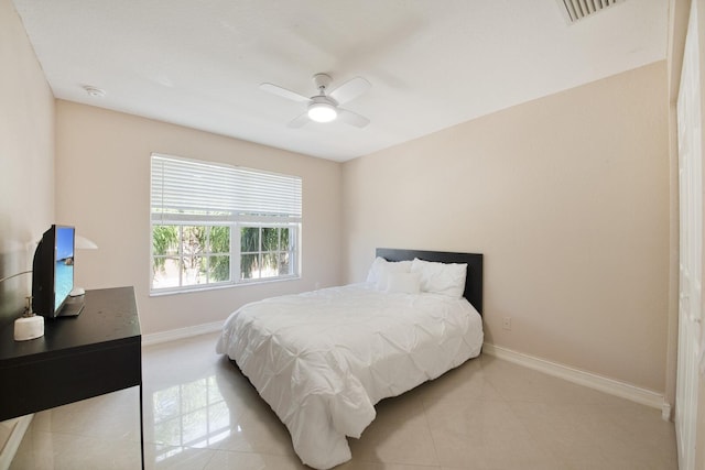 bedroom featuring light tile patterned flooring, visible vents, ceiling fan, and baseboards