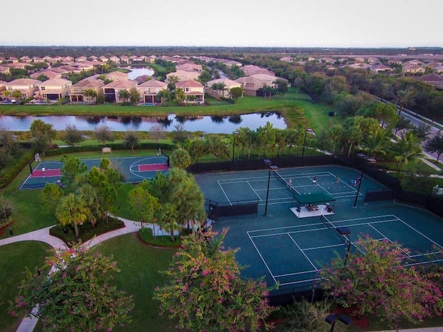 birds eye view of property featuring a residential view and a water view