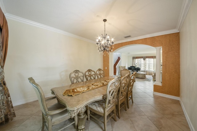 dining space with visible vents, decorative columns, light tile patterned flooring, arched walkways, and a notable chandelier