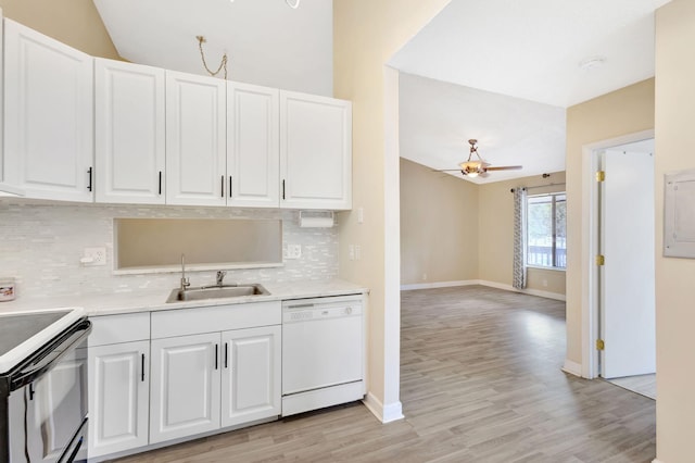 kitchen featuring light countertops, white cabinets, dishwasher, and a sink