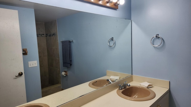 bathroom featuring vanity and a tile shower