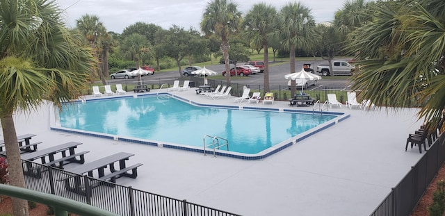 view of swimming pool featuring a patio area