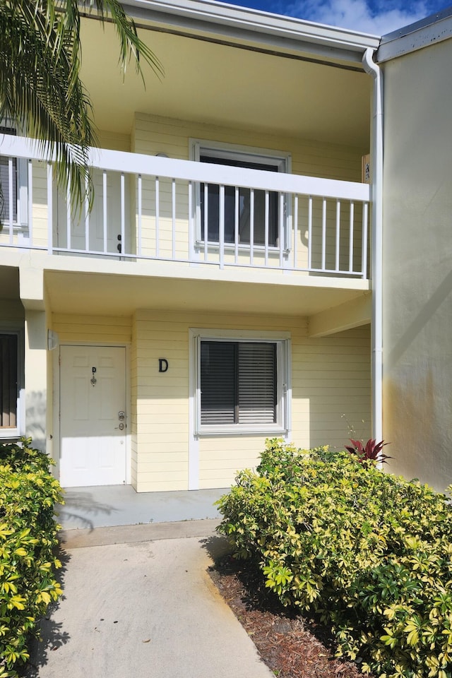 doorway to property featuring a balcony