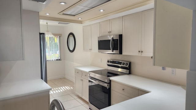 kitchen with pendant lighting, light tile patterned floors, and stainless steel appliances