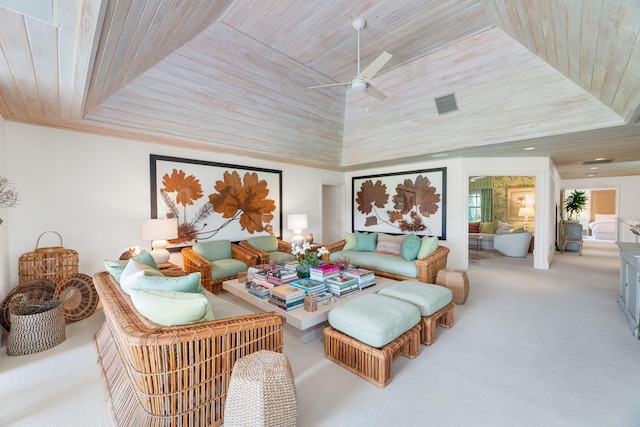 interior space with ceiling fan, light carpet, and wooden ceiling