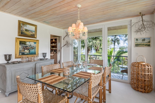 dining area featuring a notable chandelier, wood ceiling, ornamental molding, and light colored carpet