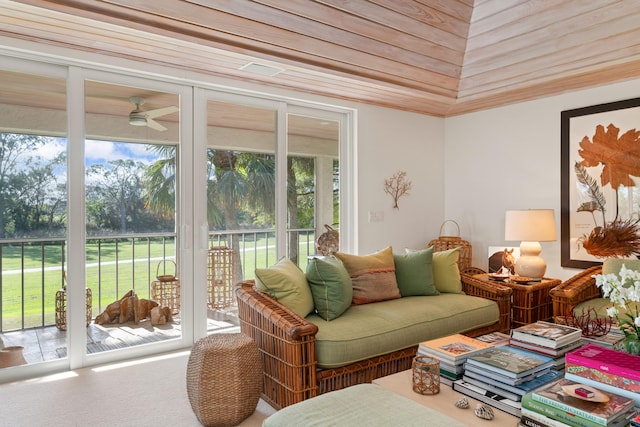 sunroom / solarium featuring ceiling fan