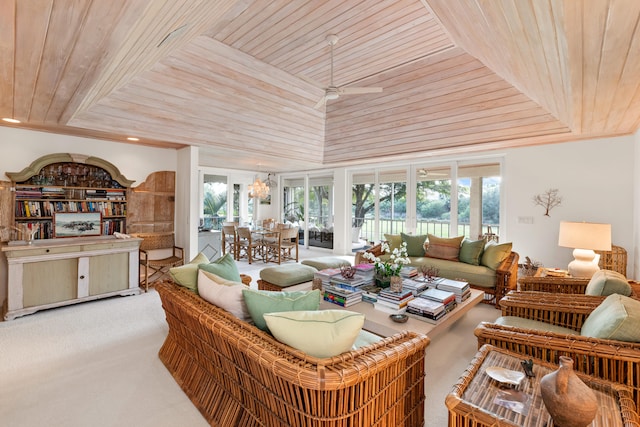 living room featuring ceiling fan, carpet, a healthy amount of sunlight, and wood ceiling