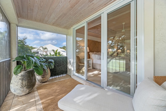 sunroom featuring wood ceiling