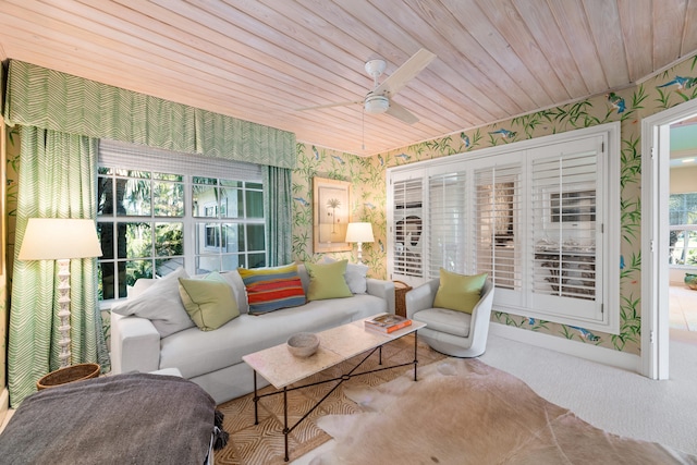 sunroom / solarium featuring ceiling fan and wooden ceiling