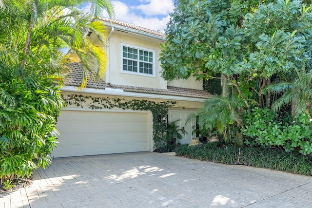 view of front of property with a garage