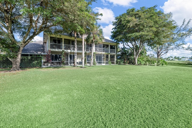 rear view of house with a lawn