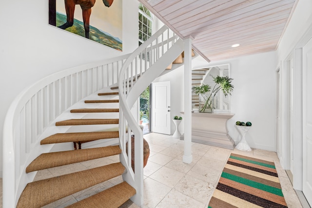 stairway with tile patterned floors