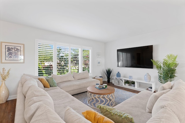 living area featuring dark wood finished floors and baseboards