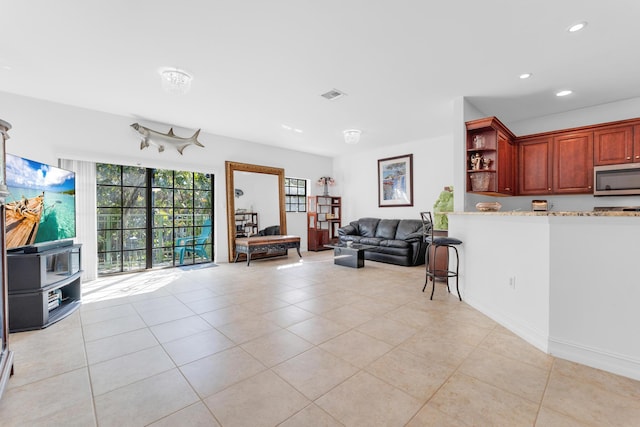 living room with light tile patterned floors