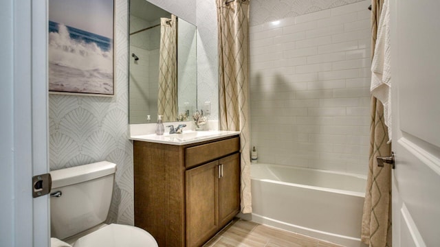 bathroom featuring shower / tub combo with curtain, wood finished floors, vanity, and wallpapered walls