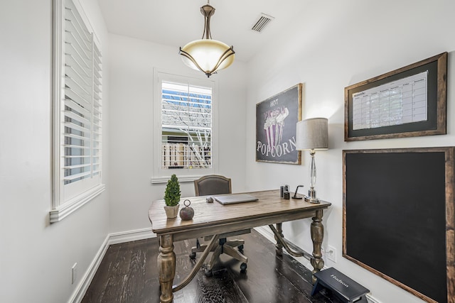 office space with wood finished floors, visible vents, and baseboards