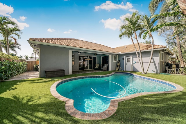 view of pool featuring a fenced in pool, a lawn, a ceiling fan, a patio area, and fence