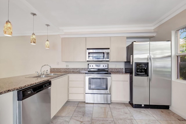 kitchen with stainless steel appliances, crown molding, hanging light fixtures, and sink