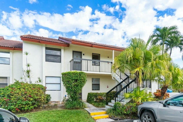 view of property featuring stairway