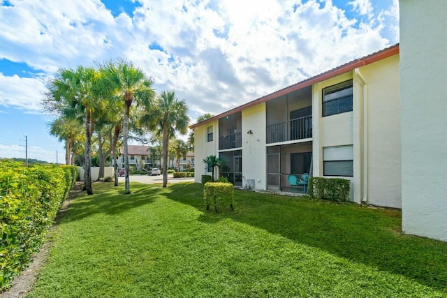 view of home's community with a yard