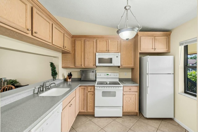 kitchen with pendant lighting, light tile patterned floors, light countertops, a sink, and white appliances