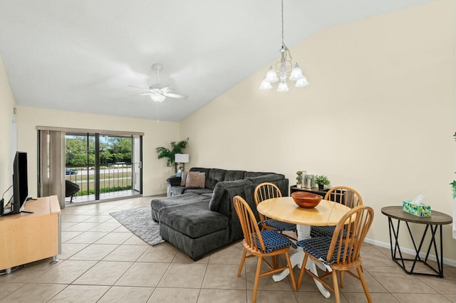 dining room featuring lofted ceiling, light tile patterned floors, baseboards, and ceiling fan with notable chandelier