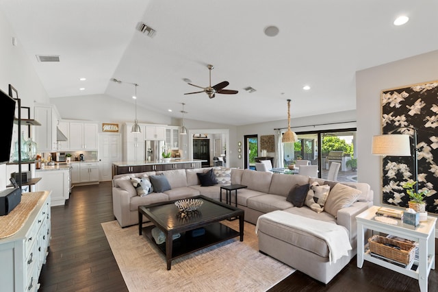 living room with ceiling fan, lofted ceiling, and dark hardwood / wood-style flooring