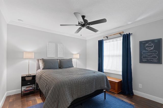 bedroom with dark wood-type flooring, ceiling fan, ornamental molding, and a textured ceiling