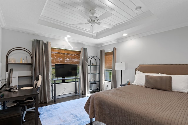 bedroom featuring ceiling fan, ornamental molding, dark hardwood / wood-style floors, and a raised ceiling