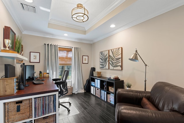 office with hardwood / wood-style flooring, ornamental molding, and a raised ceiling