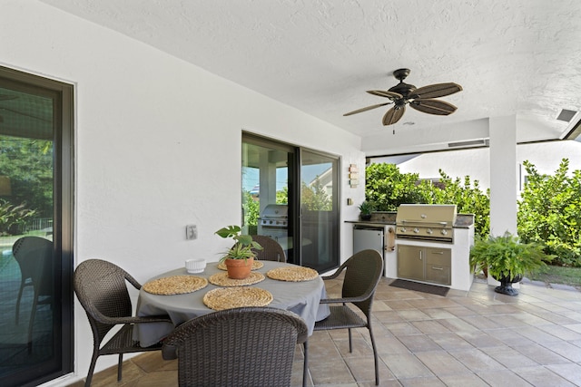 view of patio / terrace with an outdoor kitchen, area for grilling, and ceiling fan