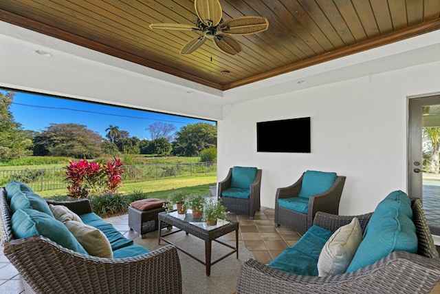 view of patio / terrace featuring ceiling fan and an outdoor living space