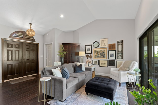 living room featuring lofted ceiling and dark hardwood / wood-style floors