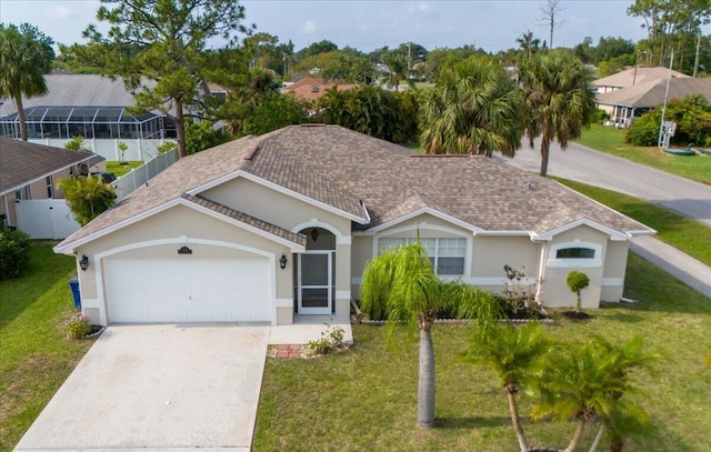 view of front of house with a garage and a front yard