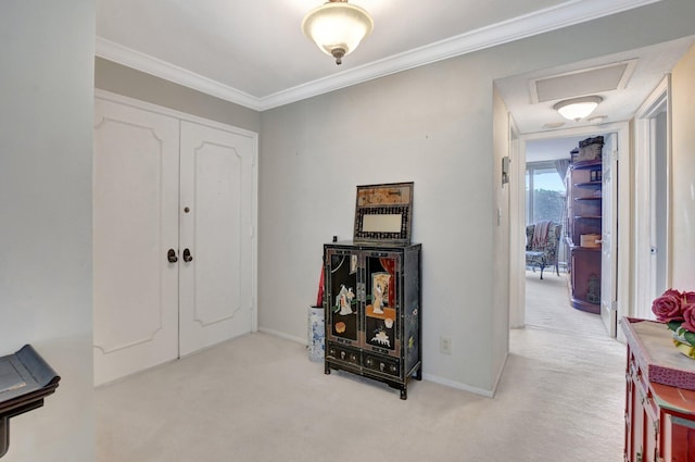 carpeted foyer entrance featuring ornamental molding