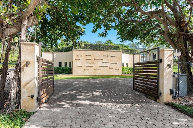 view of gate with central air condition unit