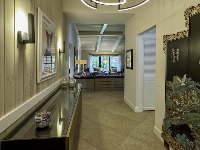 11373 Twelve Oaks Way E, North Palm Beach, FL 33408 - hallway with beam ceiling, baseboards, and light tile patterned floors